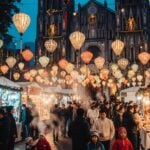 St. Joseph’s Cathedral Christmas Market in Hanoi with festive lights and holiday stalls.