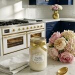 Finished jar of vanilla sugar scrub styled in a dark blue and gold farmhouse kitchen.