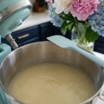Bloomed gelatin mixture resting in a stand mixer bowl before whipping.