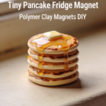 Mini pancake stack magnet made from polymer clay with glossy syrup and butter on top.