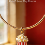 Gold bracelet with miniature popcorn bucket charm made from polymer clay.