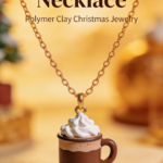 Mini hot cocoa mug necklace made from polymer clay with whipped cream detail on a gold chain, styled in warm cozy lighting.