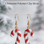 Red and white candy cane earrings made from polymer clay with gold hooks on a winter background.