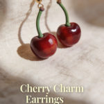 Mini cherry earrings made from polymer clay with shiny red finish and green stems.