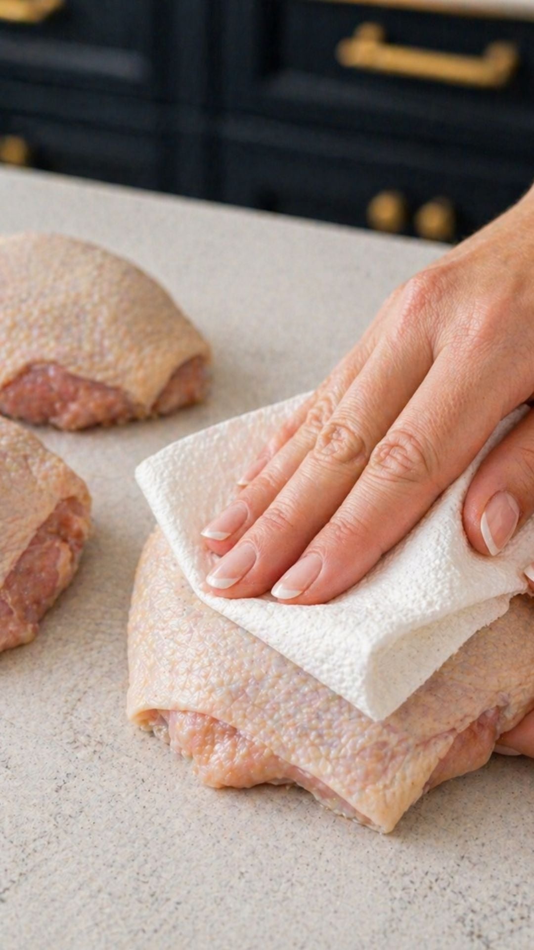 patting chicken thighs dry with paper towel before searing