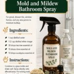 Amber glass spray bottle labeled Mold and Mildew Bathroom Spray beside a bottle of distilled white vinegar and a small tea tree essential oil bottle on a white tile bathroom surface. Room-by-room essential oil cleaning spray recipes by Aligned Design.