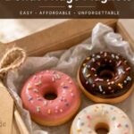 Pinterest pin image of polymer clay donut magnets styled as a handmade gift in a kraft box with text overlay reading The Cutest Handmade Gift DIY Polymer Clay Donut Fridge Magnets Easy Affordable Unforgettable