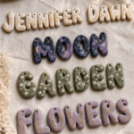 Flat lay of handmade air dry clay chunky letter ornaments arranged to spell JENNIFER DAWN, MOON, GARDEN, and FLOWERS in four color rows — cream with gold botanicals, dark navy with gold stars and crescent moon, sage green with white daisy florals, and lavender purple with gold wheat stems — styled on white linen with dried lavender, crystals, and lace.