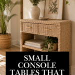 Woven rattan console table with two braided storage drawers and an open lower shelf, styled with a speckled ceramic vase, eucalyptus stems, a framed botanical print, and a small basket planter.