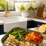 Grilled halloumi bento with roasted peppers and mixed greens.