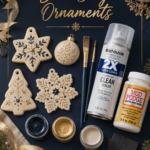 Navy flat lay of clay ornament sealing supplies including paintbrushes, spray sealer, Mod Podge, acrylic paint, and sandpaper beside painted cream ornaments.
