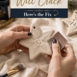 Close-up of hands with dark navy nail polish sanding a cream clay star ornament with fine-grit sandpaper.