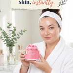 Pinterest pin featuring a woman in a white spa robe holding a Korean collagen cream in a bright luxury bathroom. The image includes the text "Your Secret to Glass Skin, Instantly" and highlights a Korean collagen moisturizer designed to hydrate skin, improve radiance, and support a healthy glass skin skincare routine.