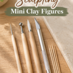 Five mini clay sculpting tools laid out on a wood surface — a needle tool, a ball-tip stylus, a craft knife, and a small bundle of toothpicks, next to a ceramic tile. Board: your main clay/craft board